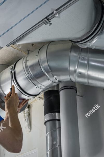stock-photo-hvac-worker-install-ducted-pipe-system-for-ventilation-and-air-conditioning-copy-space-1984711982