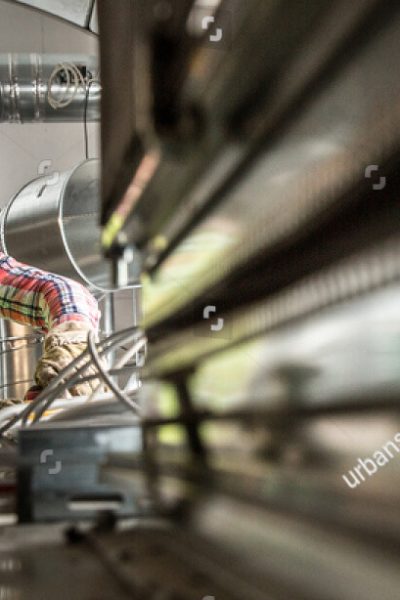 stock-photo-portrait-of-a-worker-constructing-and-checking-development-of-a-small-business-hall-reliable-542960644